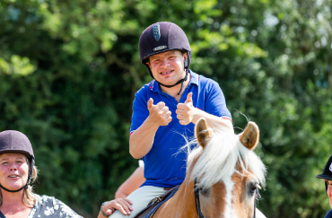 RDA rider with thumbs up